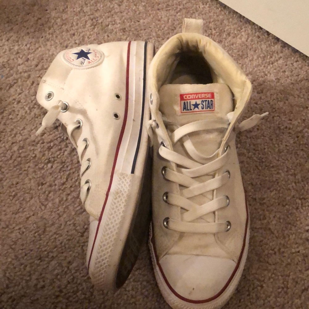 Dirty white high top converse.